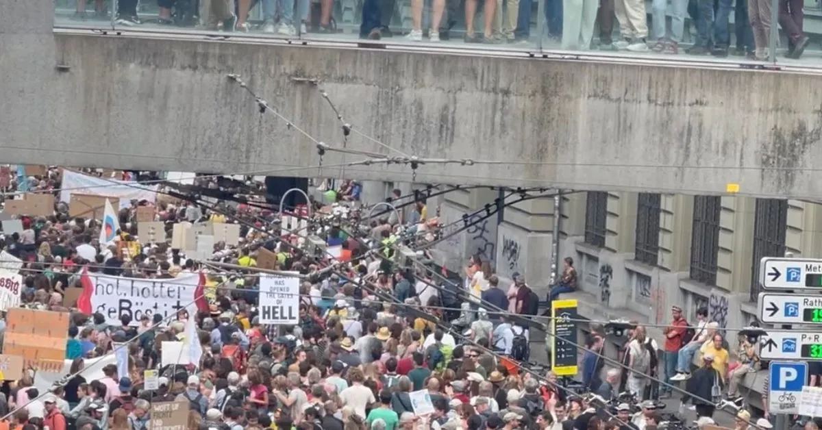 Tens of thousands demand climate action in Swiss capital