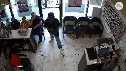 Atlanta-area nail salon customers ignore would-be robber's demands, video shows