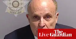 Trump Georgia case: Giuliani mugshot released as Meadows and Clark lose attempts to block arrest – live