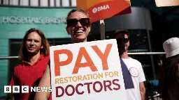Pay rise announced as junior doctors strike in England