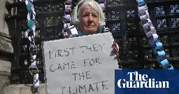 Protester who held sign outside London climate trial prosecuted