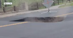 Caught on video: Large hole forms in middle of road in Parker