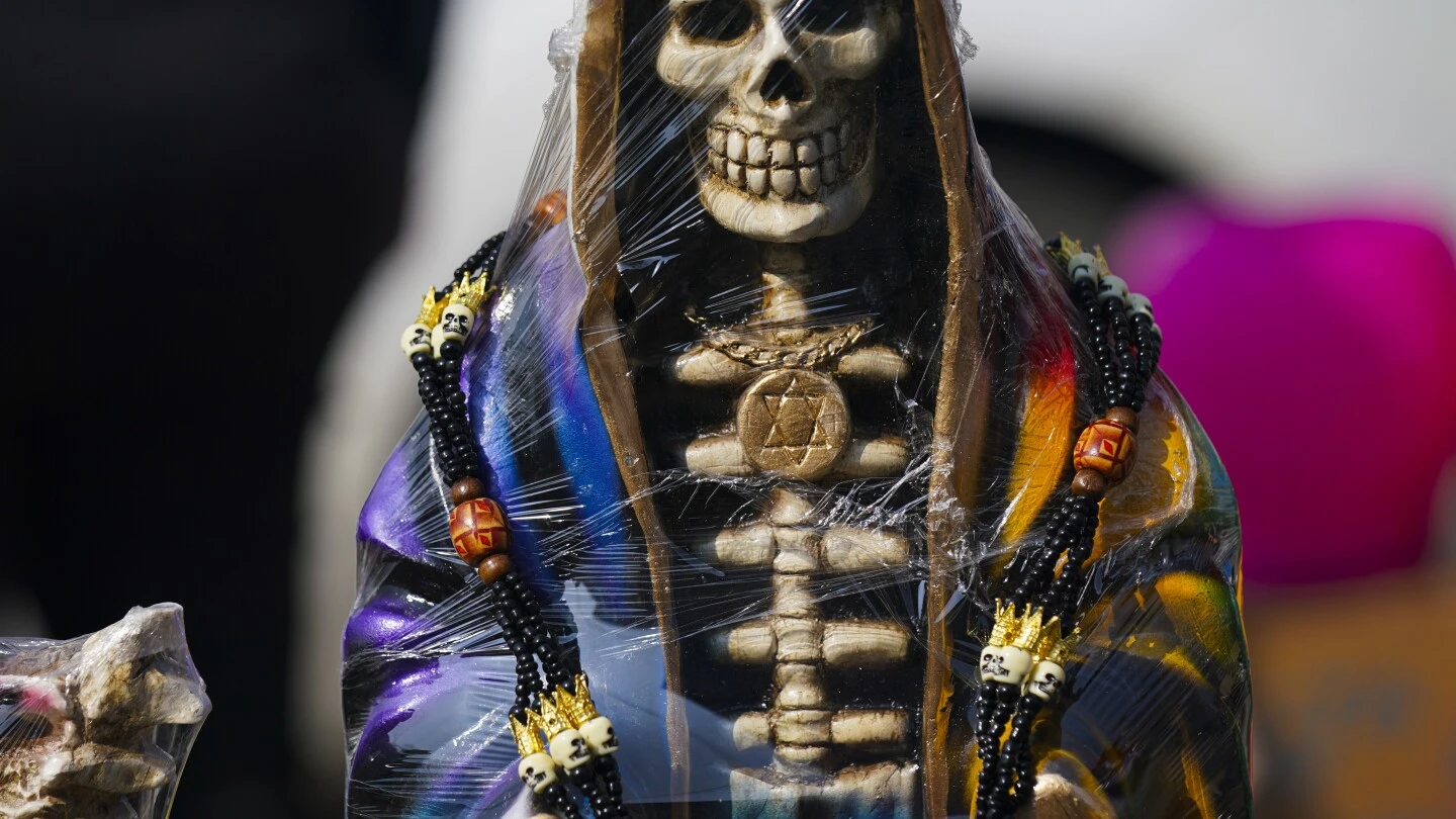 A leader of Mexican folk saint cult 'La Santa Muerte' is killed at an altar to the skeletal figure