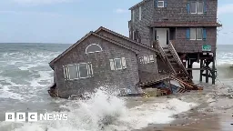 Watch: Moment beach house collapses into ocean