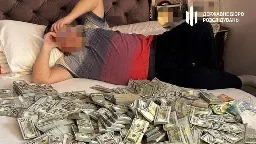 Corrupt Ukrainian official’s son found lying in bed with huge sum of money, $6 million in total seized from medical fraud operation