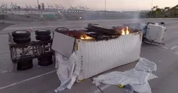 A truck full of batteries has been burning for almost a full day, shutting down ports in LA