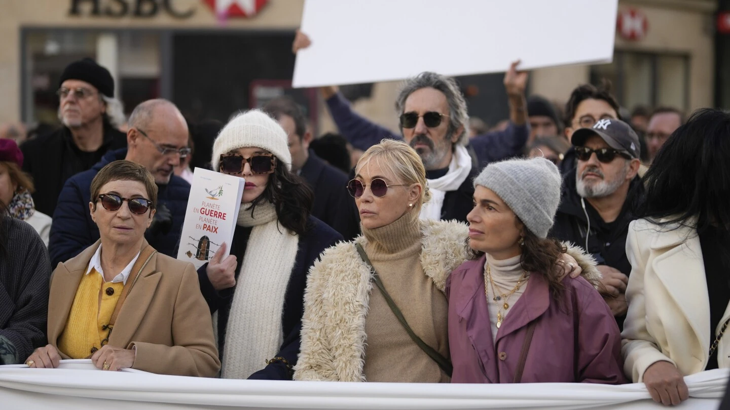 French performers lead a silent Paris march for peace between Israelis and Palestinians