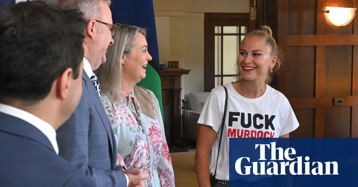 Grace Tame wears anti-Murdoch shirt to PM’s morning tea in snipe at ‘morbidly wealthy oligarchs’