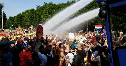 Netherlands police use water cannon, detain 2,400 climate activists