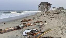 Outer Banks home falls into the ocean, highlighting a grim trend. See the photos.