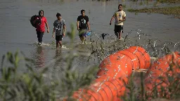 Justice Department sues Texas over floating barrier in Rio Grande River