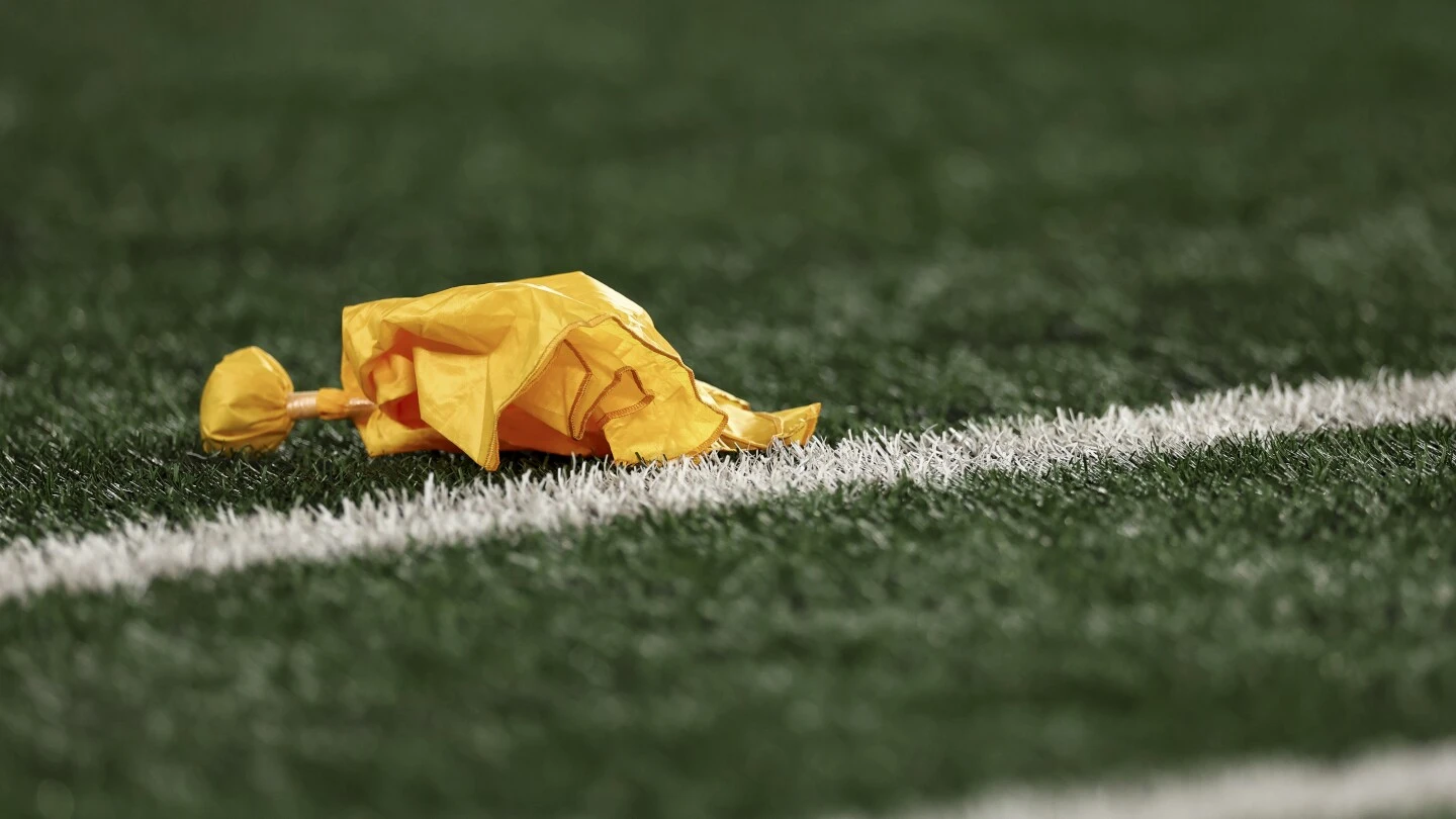 NFL won't instruct officials to throw flags for pulling runners