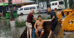Flooded rivers, trapped residents test China's disaster response